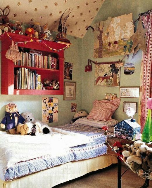 a child's bedroom with stuffed animals and bookshelves on the wall above the bed