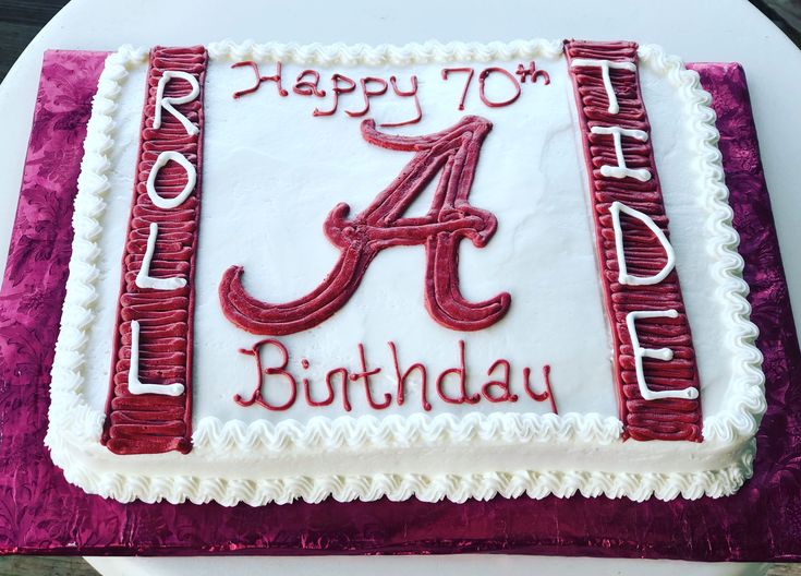 a birthday cake with the letter a in red and white frosting on it's side