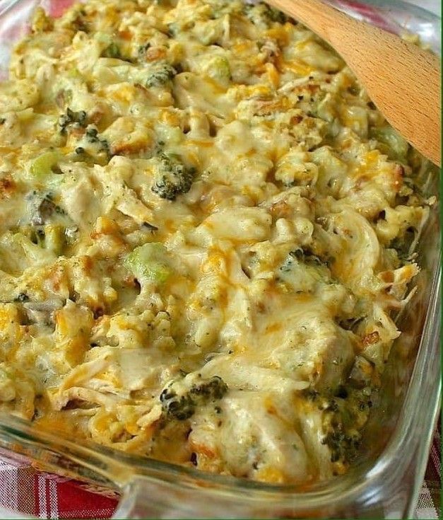 a casserole dish with broccoli and cheese in it on a table