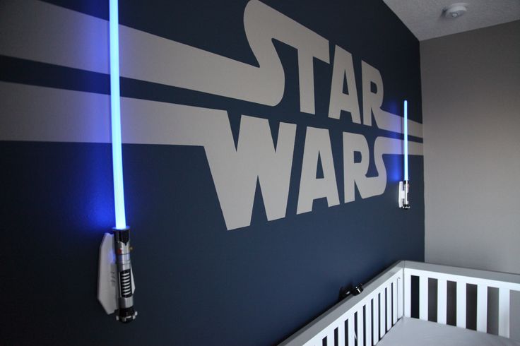 a star wars themed nursery room with lights on the wall