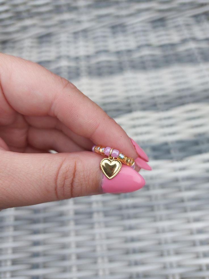 Homemade beaded ring with heart charm! Heart-shaped Metal Ring Jewelry For Valentine's Day, Heart-shaped Metal Ring For Valentine's Day, Trendy Heart Beads Jewelry Gift, Trendy Heart Beads Jewelry As Gift, Trendy Heart Beads Jewelry For Gifts, Trendy Adjustable Heart-shaped Rings, Heart Shaped Beaded Jewelry Gift, Heart Shaped Tiny Beads Jewelry Gift, Trendy Beaded Heart Pendant Jewelry