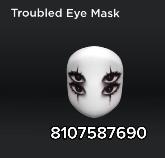 a white mask with black eyes and long eyelashes on it's face is shown in front of the words trouble eye mask