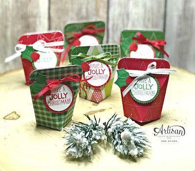 six small christmas gift boxes on a table