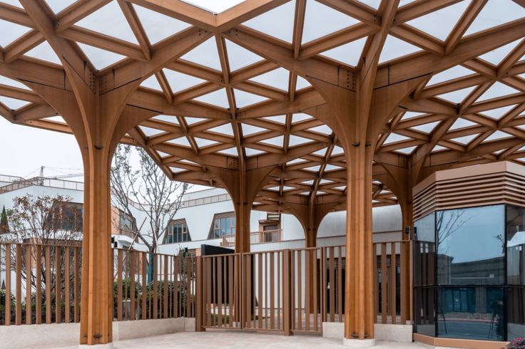 an outdoor covered area with wooden structures