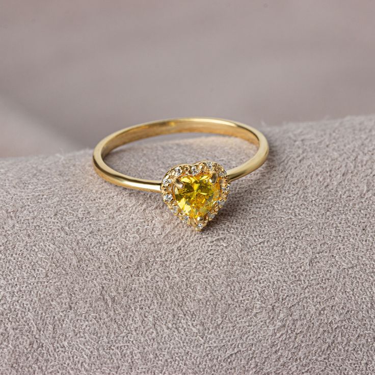 Yellow Topaz; It is known as the stone of abundance and fertility and has energizing properties. It purifies the mind from excesses and helps the person to have a comfortable sleep at the end of the day. Yellow Topaz is one of the strong and powerful healing stones. Our 14K Solid Gold heart-cut yellow topaz ring surrounded by real diamonds is suitable for daily use with its special design and will be your indispensable jewelry that you can use on your special days. A stylish jewel for you and yo Yellow Halo Jewelry For Gifts, Heart-shaped Yellow Gold Birthstone Ring, Citrine Birthstone Diamond Ring Gift, Gift Citrine Birthstone Diamond Ring, Yellow Crystal Birthstone Ring For Promise, Yellow Birthstone Crystal Ring For Promise, Yellow Birthstone Ring With Center Stone As Gift, Spiritual Yellow Gold Promise Ring Birthstone, Spiritual Yellow Gold Birthstone Promise Ring