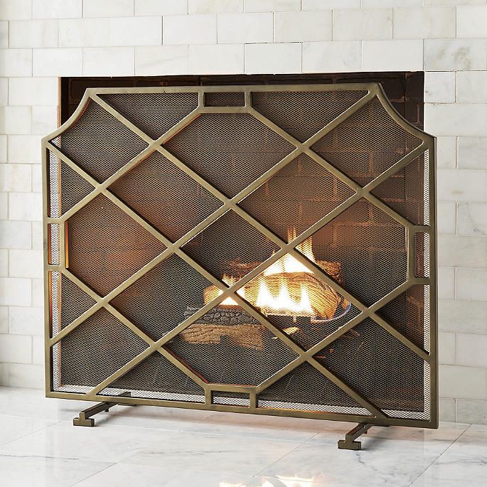 a fireplace screen with a fire in it