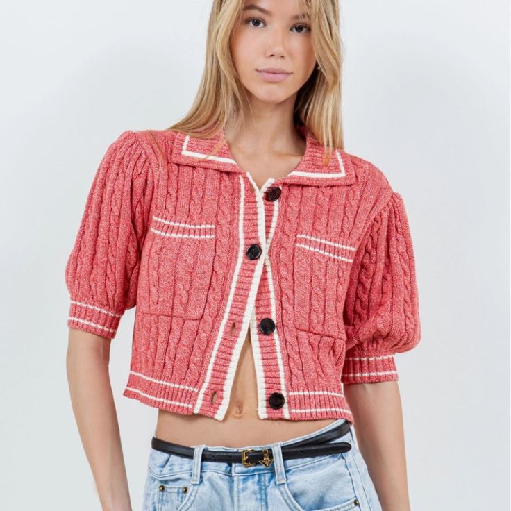 Elevate your casual look with our Cardigan Tee, a cropped knit tee in a trendy reddish-pink hue. Perfect for those preppy yet laid-back spring and summer days. Material & Care: Crafted from 60% cotton and 40% acrylic. Hand wash in cold water with mild detergent. Avoid wringing or twisting. Lay flat to dry away from direct sunlight. If needed, use a cool iron. Size & Fit: Model is 5'9 wearing size small Pink Cropped Sweater For Spring, Casual Cropped Sweater For Summer, Pink Cropped Cardigan For Spring, Trendy Cropped Cotton Cardigan, Trendy Cropped Summer Cardigan, Chic Cropped Pink Cardigan, Casual Pink Cropped Sweater, Trendy Short Sleeve Sweater For Day Out, Trendy Knit Cropped Sweater For Summer