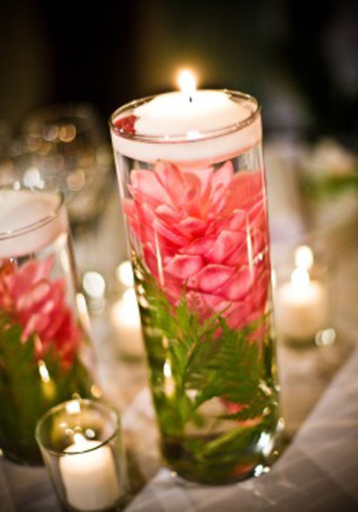 an instagram page with candles and flowers in glass vases on the left side