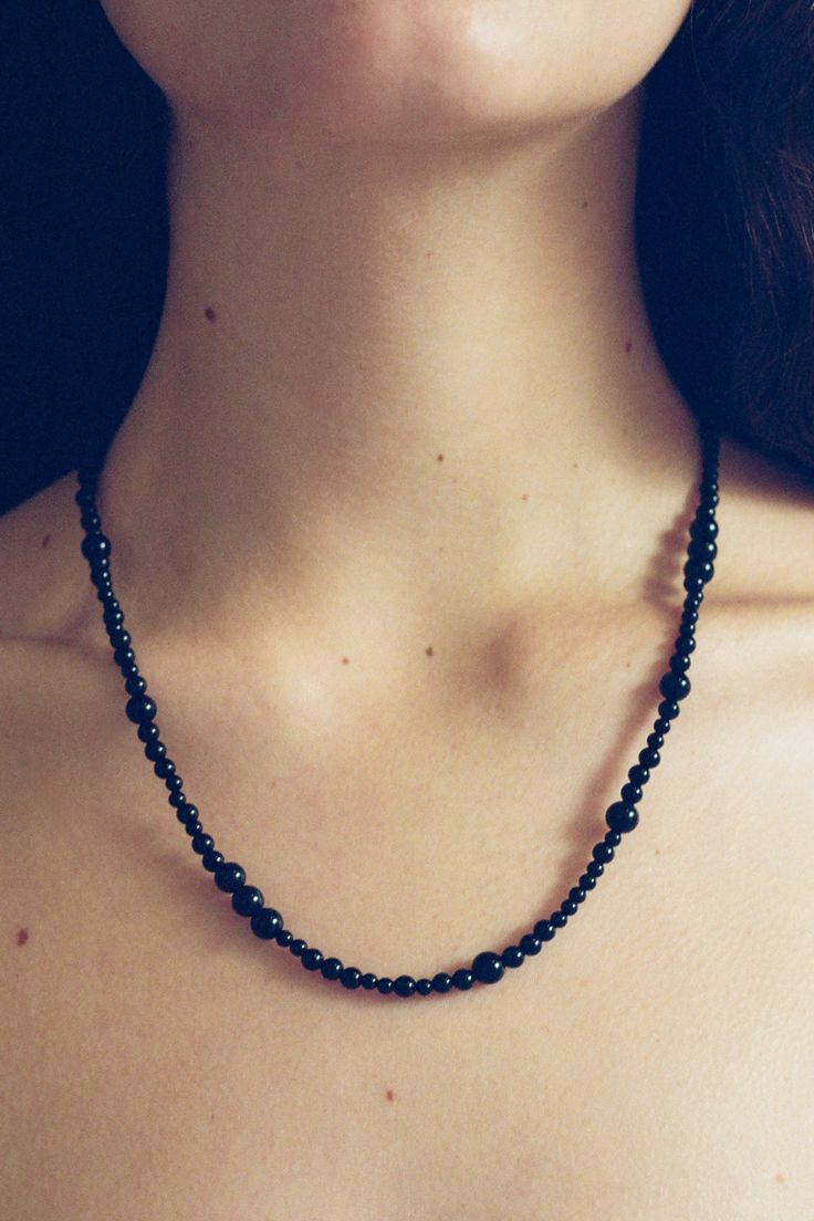 Constellation Necklace In Onyx 20in Classic Onyx Necklace With Black Beads, Classic Single Strand Beaded Necklace, Classic Adjustable Single Strand Beaded Necklace, Black Onyx Round Beaded Necklaces, Classic Onyx Beaded Necklace With Black Beads, Formal Onyx Beaded Necklaces With Polished Beads, Formal Onyx Beaded Necklace With Polished Beads, Formal Onyx Beaded Necklace With Round Beads, Formal Onyx Beaded Necklace