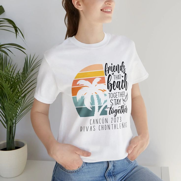 Friends Beach Shirt with Retro Vibes is a perfect summer shirt for your girlfriend trip to the beach! Be ready for your summer vacation with this soft and fun beach tee! Available in White, Peach and Grey. To personalize: Write city and year in the personalization box on this page. You can change the customization to say whatever you like - for a bridesmaid weekend it could say "Heidi's Hens, or Taylor's Crew, Bride Squad etc. If the box is left blank, there will be no city/year added to the shi White Print Relaxed Fit Top For Vacation, Relaxed Fit White Print Top For Vacation, Summer Tops With Graphic Print For Family Vacation, Beachy Short Sleeve Tops For Family Vacation, White Palm Tree Print Top For Vacation, Summer Cotton Tops For Family Vacation, White Vacation Tops With Palm Tree Print, Summer Graphic Print Tops For Family Vacation, Summer Letter Print Top For Family Vacation