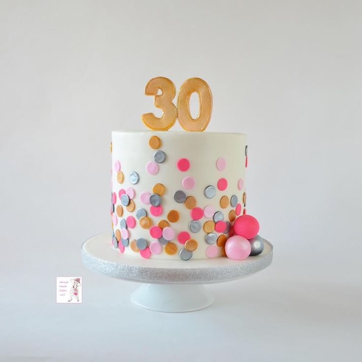 a birthday cake decorated with confetti and the number 30 on it's top