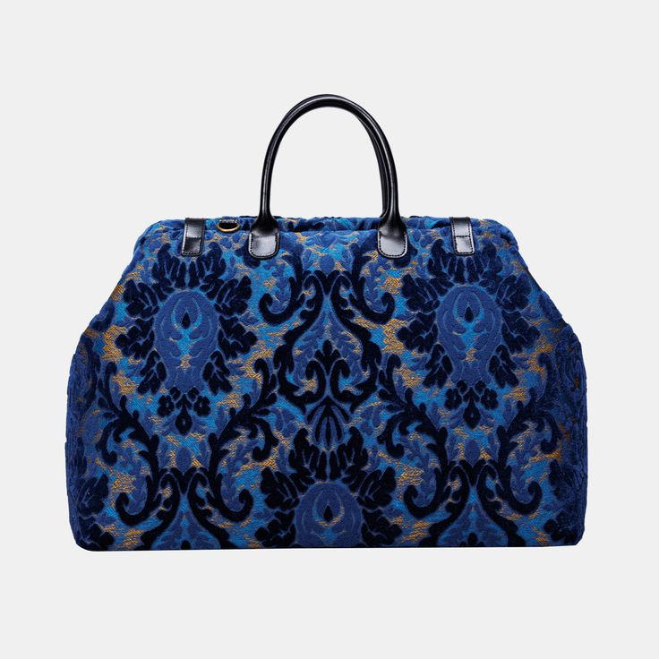 With a nod to the Victorian era, MCW’s freshly combines the classic and elegant design of the traditional carpet bag with a textural and tactile twist.This spacious travel bag is made of thick chenille carpet, the belt and handles are made of genuine leather with heavy weight cotton canvas lining. There are 6 brass studs at the bottom. Every bag comes with a detachable and adjustable shoulder strap 55”in length. The strap is made of same chenille as the bag with leather anti-loose ring, attached Elegant Tote Duffle Bag For Weekend Trips, Elegant Weekend Tote Duffle Bag, Luxury Weekender Bag For On-the-go, Elegant Tote Weekender Bag, Luxury Satchel With Rolled Handles For On-the-go, Luxury Satchel For Weekend Trips With Top Carry Handle, Elegant Tote Weekender Bag For Weekend Trips, Elegant Weekender Tote Bag For Weekend Trips, Luxury Weekender Bag With Double Handle For Shopping