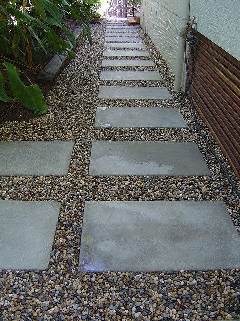 a walkway made out of stones and gravel