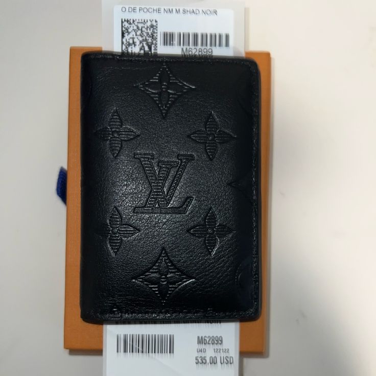 Luis Vuitton O.De Poche Nm M.Shad.Noir Designer Black Card Holder With Rfid Blocking, Designer Black Wallets With Interior Card Slots, Designer Black Bifold Card Holder, Luxury Black Card Holder For Travel, Designer Black Card Holder For Everyday Use, Luxury Black Wallet With Rfid Blocking, Jean Bucket Hat, Louis Vuitton Mens Wallet, Louis Vuitton Black