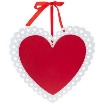 a red heart shaped ornament hanging from a string on a white background with a red bow