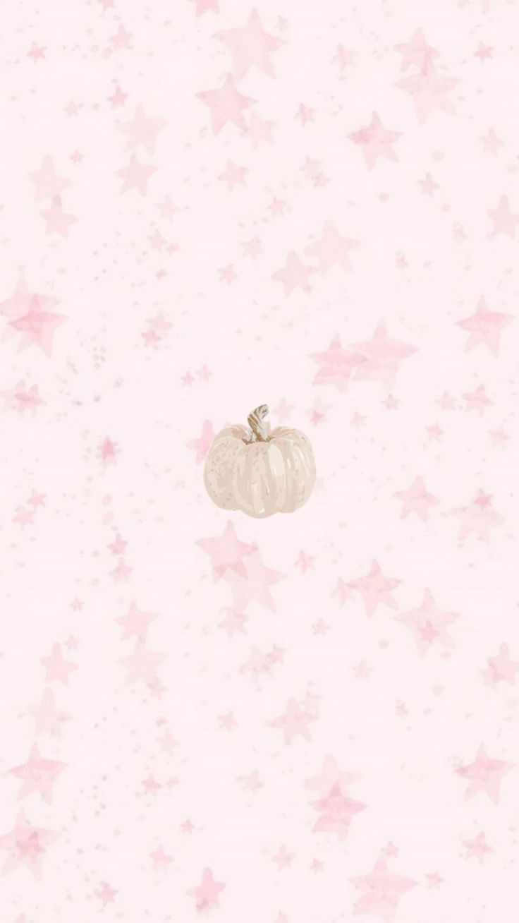 a white pumpkin sitting on top of a pink wallpaper covered in stars and sparkles