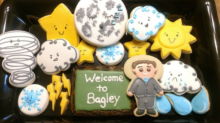 a tray filled with cookies and decorations on top of a table