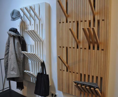 the coat rack is made out of wooden slats