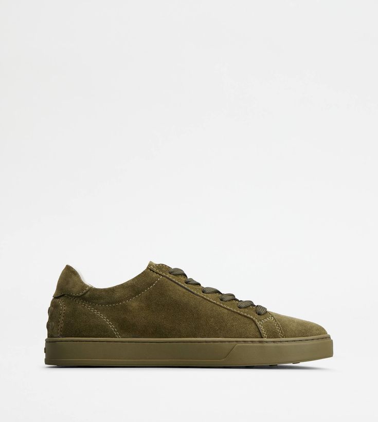 A sober and sophisticated taste characterizes these sneakers with minimal lines, with Tod's logo on the tongue. Crafted in soft suede, they come with a rubber outsole with embossed rubber pebbles. Green Suede Lace-up Sneakers, Green Suede Sneakers With Round Toe, Green Suede Sneakers With Contrast Sole, Green Suede Sneakers With Rubber Sole, Green Leather Sole Sneakers For Streetwear, Green Sneakers With Leather Sole For Streetwear, Green Suede Low-top Custom Sneakers, Classic Green Sneakers With Textured Sole, Green Suede Casual Sneakers