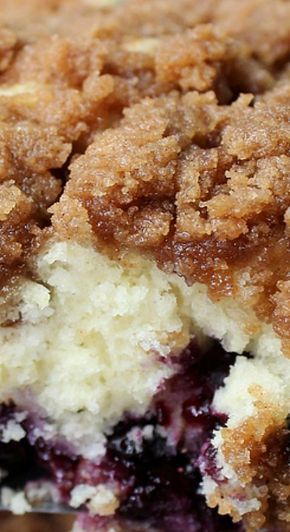 a close up view of a blueberry crumb cake