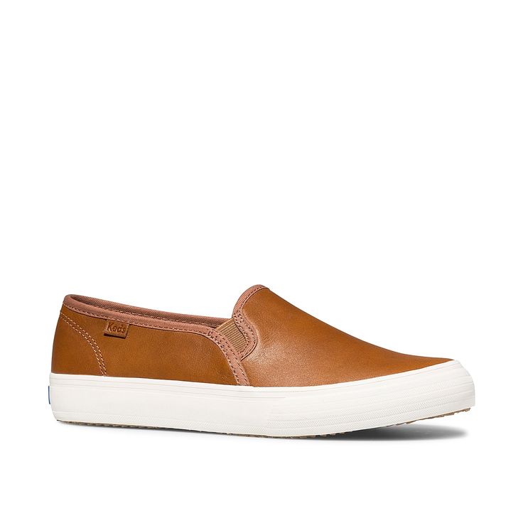 Keds-Double Decker Slip-On Sneaker - Women's The Keds Double Decker slip-on sneaker is a sporty silhouette with an edge of sophistication. Made of leather, it is equipped with Dream FoamÃ¢ Â¢ footbed that provides comfort and support all-day long. Sporty Brown Slip-ons With Rubber Sole, Brown Low-top Slip-ons With Contrast Sole, Sporty Leather Slip-ons With Vulcanized Sole, Sporty Brown Slip-ons With Round Toe, Classic Slip-on Sneakers With Vulcanized Sole, Casual Brown Slip-ons With Contrast Sole, Sporty Slip-ons With Gum Sole And Round Toe, Sporty Brown Slip-on Sneakers With Textured Sole, Comfortable Brown Slip-on Sneakers For Spring