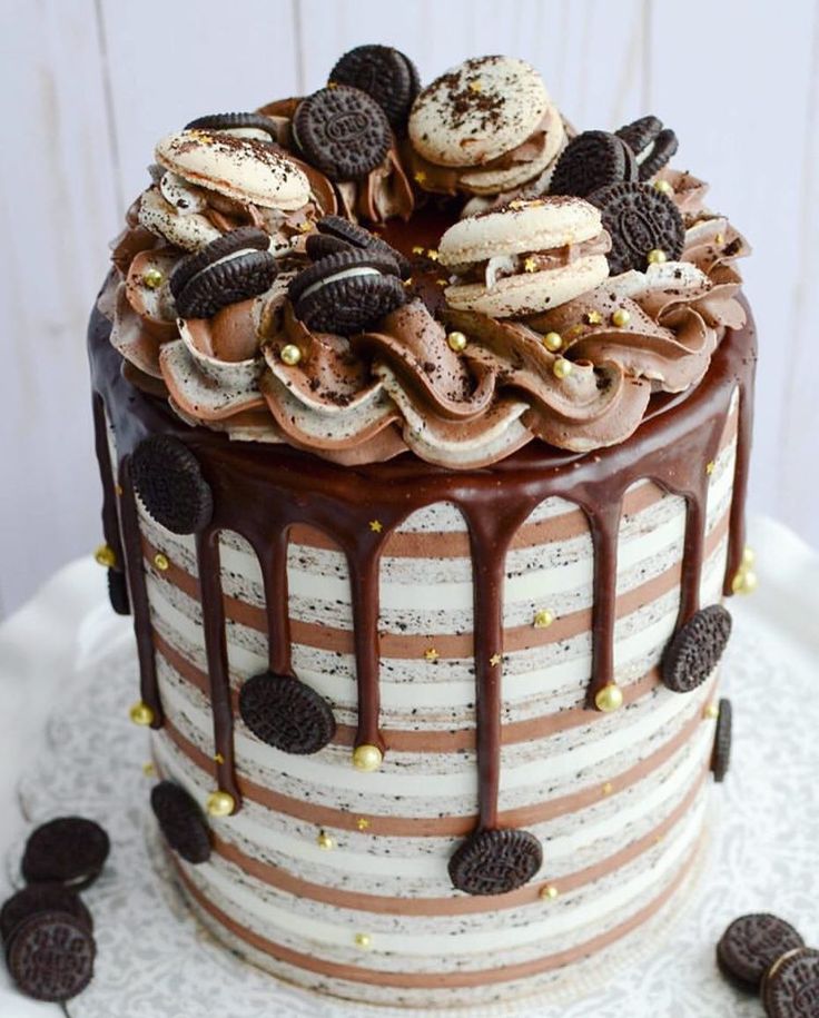 a chocolate cake with cookies and oreo cookies on top