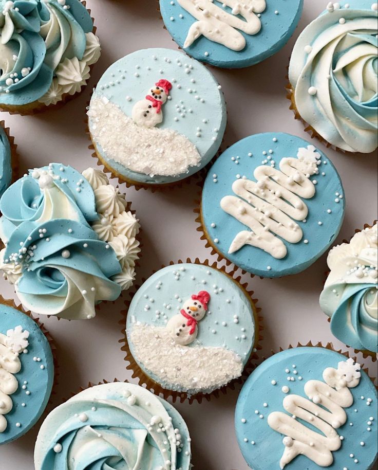 cupcakes decorated with blue frosting and white icing