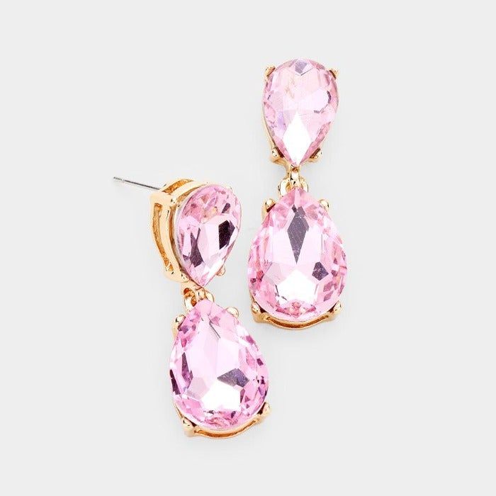 Pink Crystal Double Teardrop Gold EarringsItem: EarringsVendor: Sparkle ArmandColor : Pink, Gold Size : 0.5" W, 1.25" L Fastening: Post BackMetal: Alloy, Lead & Nickle FreeMaterial: Crystal teardrop Theme: Evening, Prom, Pageant, Bridal Pageant Jewelry, Pageant Earrings, Rhinestone Earrings, Circle Earrings, Pink Crystal, Huggies Earrings, Tassel Earrings, Teardrop Earrings, Long Earrings