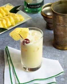 there is a drink with pineapple on the table