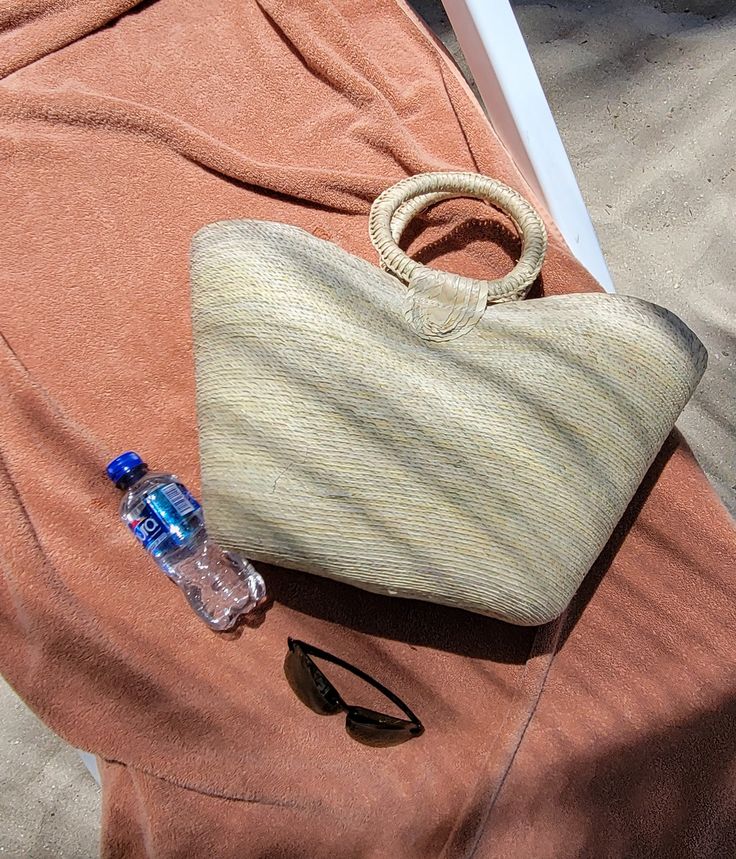 Meet you new summer bag. This large woven farmers market bag with handle is perfect to take to beach or to market. Its versatile and trendy. Measures 21" x 13" Add pompom and make it unique. ( Pompom shown in this picture is just sample not included with bag.) Handmade in Mexico. Sand-colored Straw Bag For Summer Beach, Summer Sand-colored Straw Bag, Beach Bag With Braided Handles, Summer Beach Shoulder Bag Made From Palm Leaf, Basket Beach Bag Made Of Natural Fiber For Vacation, Bohemian Straw Bag For Vacation Shopping, Bohemian Summer Straw Bag With Double Handle, Bohemian Straw Bag For Beach Season Shopping, Bohemian Beach Bag In Natural Fiber For Vacation