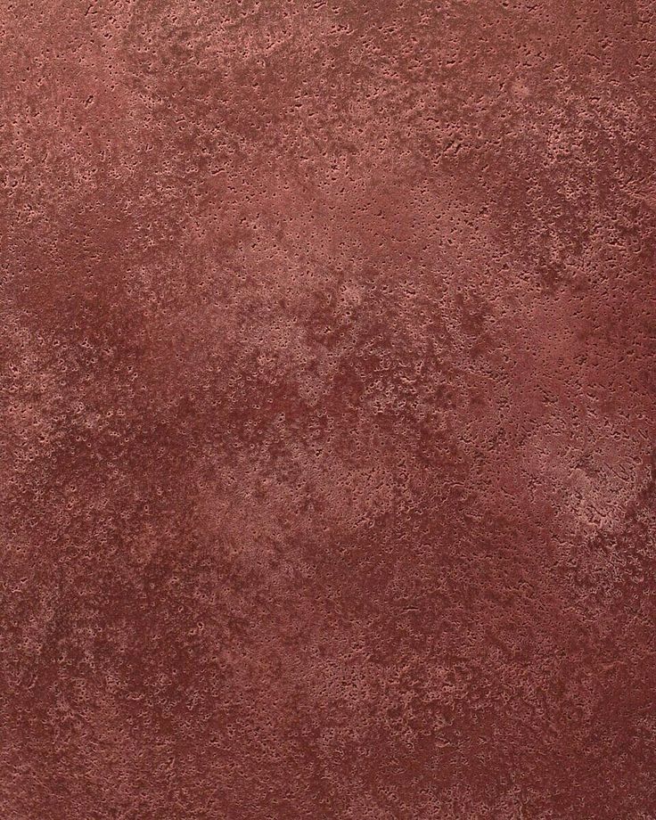 a red area rug that looks like it is covered in dirt