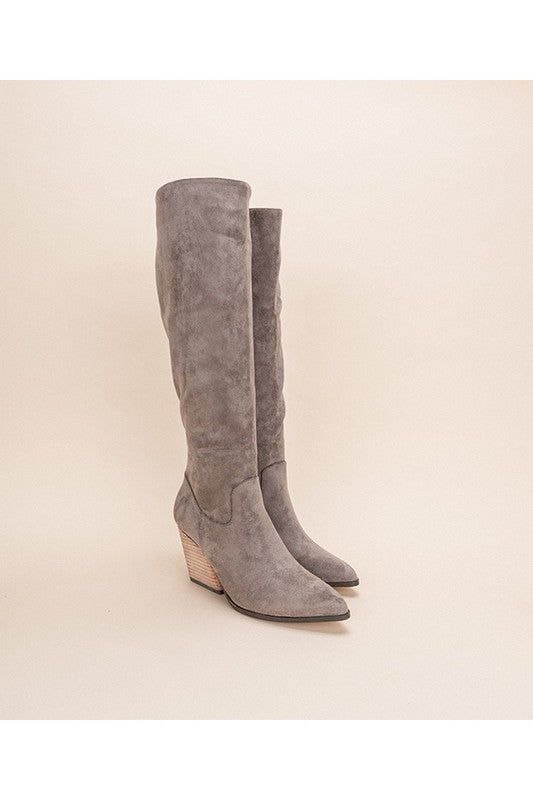 The LACEY is a bold knee high boot set on a stylish slanted heel for a subtle nod to the western trend. Set on a stylish slanted heel for a subtle nod to the western trendUpper Material:Man-made suede upperInsole Material:Padded InsoleSole or Heel Material:Leather wrap heelShaft Height: 16"Heel Height: 3.25"The front platform: 0.25"Types of closures: zipperCircumference of shoe opening:15" Bottom of the sole: 5.25" Style: CASAL,WESTERN Length: 19.25" Closure: ZIPPER Heel Height: 3.25" Material C Knee High Western Boots, Western Trend, Zipper Heels, Wrap Heels, Flowing Dresses, Suede Boots Knee High, Grey Boots, Suede Material, Artificial Leather