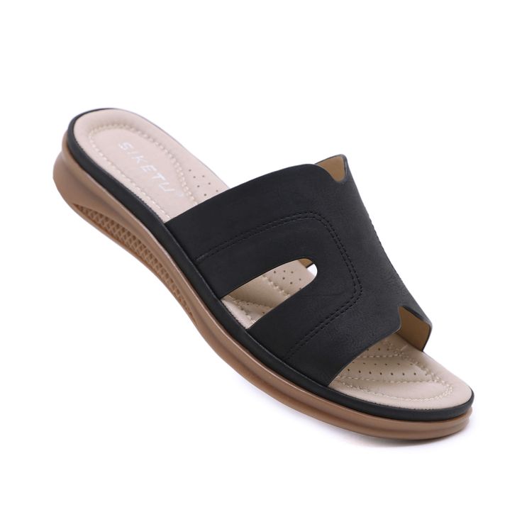 Walk with comfort and style in our Siketu Off the Coast Cushioned Flat Sandals. The perfect blend of fashion and practicality, these sandals provide cushioned support for your feet while boasting a trendy coastal look. Available in apricot, add a touch of whimsy to your summer wardrobe. Cheers to happy feet! 0.98'' heel Slip-on PU upper Synthetic Arch support footbed™ Cushioned Insole™ Anti-skid rubber sole Comfortable Black Slip-on Wedge Sandals, Black Flip Flops With Arch Support For Spring, Black Wedge Sandals With Arch Support For Beach, Black Beach Wedge Sandals With Arch Support, Black Wedge Sandals With Arch Support For Vacation, Comfortable Black Sandals With Ortholite Insole, Comfortable Black Sport Sandals For Beach, Comfortable Black Sport Sandals For Vacation, Comfortable Black Casual Wedge Sandals