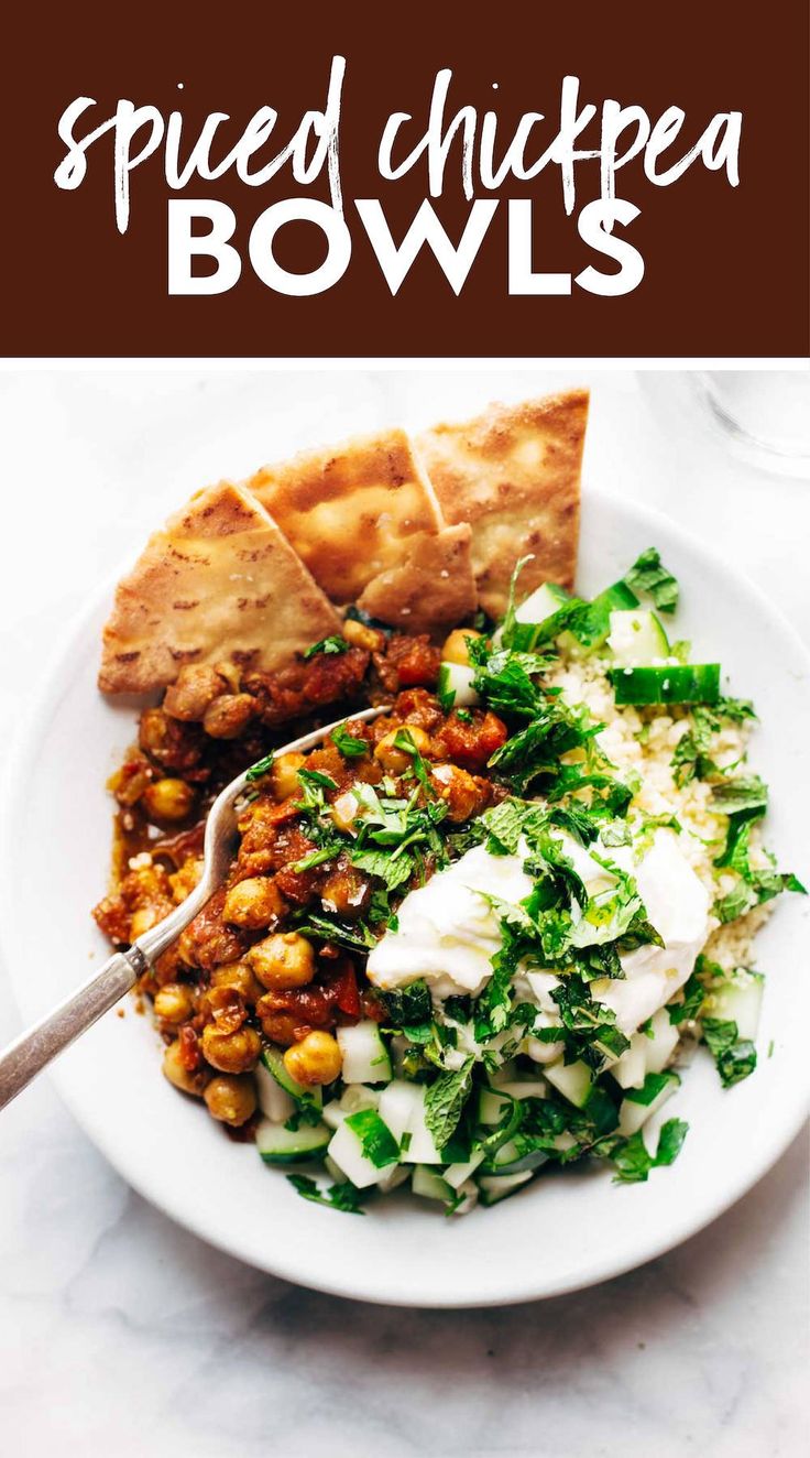 a white plate topped with salad and pita bread