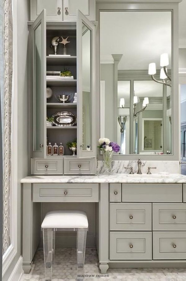 a large bathroom with two sinks and an open cabinet in the middle, along with a stool