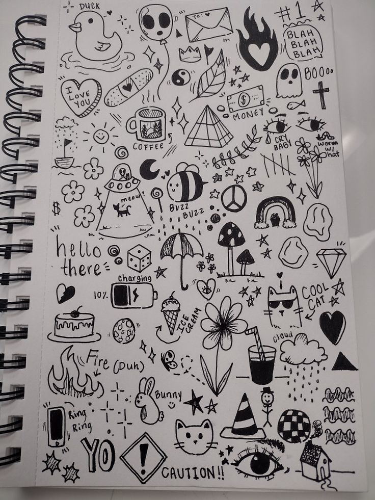 a notebook with lots of doodles on it