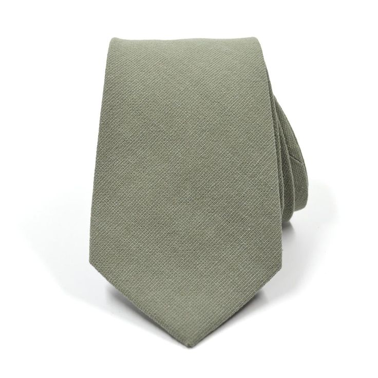 Handmade with 100% imported cotton fabric. Perfect for work, weddings or a night out on the town. This Linen Sage Green Tie will make you feel like the gentleman you aspire to be or accentuate the gentleman you already are. You’ll look good, feel good and do good things in this tie. Makes the perfect gift for a fellow gentleman or for that man in your life by making them look good and feel good. We guarantee your satisfaction with our free refund policy.* Goes Good With: Black, Grey, Tan, GreenM Elegant Cotton Ties For Spring, Elegant Cotton Suit And Tie Accessories For Wedding, Formal Cotton Suit And Tie Accessories For Summer, Elegant Cotton Suit And Tie Accessories For Summer, Summer Formal Cotton Suit Accessories, Spring Business Cotton Suit And Tie Accessories, Classic Spring Suit And Tie Accessories For Semi-formal, Dapper Cotton Ties For Formal Occasions, Dapper Cotton Tie For Formal Occasions