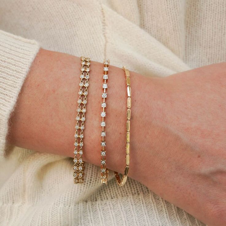 Every bracelet stack needs a solid gold option to add texture and that signature bold gold shine. We love the Melody Eden Gold Bar Bracelet for delivering on the substantial gold look with a lightweight feel and attainable price point. The stations are comprised of high-shine 14k karat gold and are hollow, so they never feel heavy, and the semi-fixed design means this station bracelet wears like your favorite cuff. With an adjustable length, this gold bracelet has everything you need for your growing bracelet collection. 14 Karat Gold Adjustable Length 6.5-6.75 Inches 2.4mm in Width Need Sizing help?Size Guide Lobster Clasp Modern Gold Stackable Bracelets, Modern Gold Tennis Bracelet With Rectangular Links, Modern Gold Diamond Bracelet With Rectangular Links, Modern Stackable Bangle Tennis Bracelet, Modern Stackable Tennis Bracelet For Everyday, Modern Stackable Tennis Bracelet, Gold Diamond Bracelet With Rectangular Links For Everyday Luxury, Gold Diamond Jubilee Bracelet For Everyday Luxury, Modern Gold Tennis Bracelet For Everyday Luxury