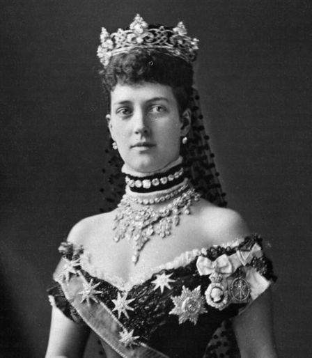 an old black and white photo of a woman wearing a tiara