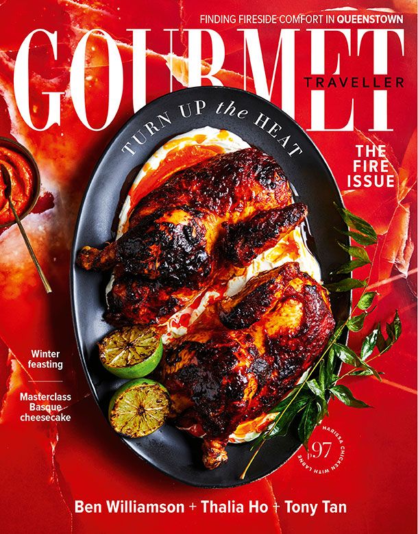 the cover of gourmet traveller magazine featuring grilled chicken on a black plate