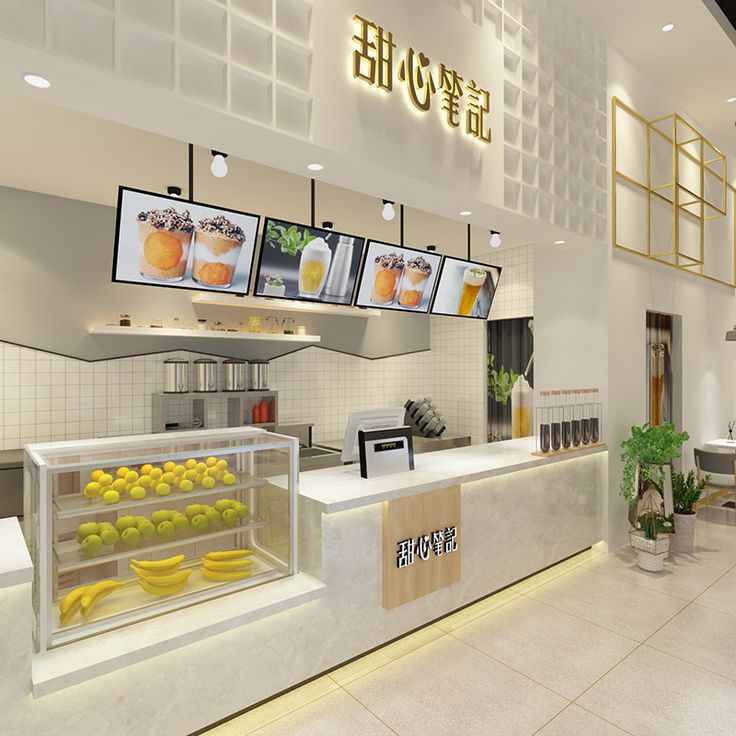 an interior view of a restaurant with bananas and lemons in the display case on the counter