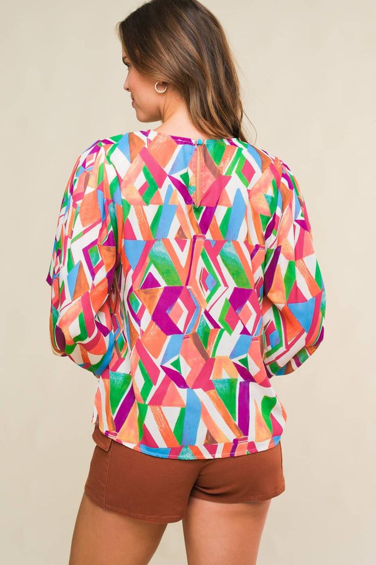 A printed woven top featuring round neckline, wide long sleeve with cuff and back neck button closure Details: Self : 100% Polyester Size & Fit - Model is 5`8" And Wearing Size Small- Measurements Taken From Size Small- Approx. Length: 24" Long Sleeve Tops With Abstract Print For Work, Multicolor Lantern Sleeve Printed Blouse, Multicolor Bold Print Tops For Workwear, Chic Long Sleeve Blouse With Abstract Print, Multicolor Abstract Print Long Sleeve Blouse, Multicolor Printed Lantern Sleeve Blouse, Multicolor Printed Blouse With Lantern Sleeves, Multicolor Tops With Elastic Sleeves For Spring, Chic Multicolor Lantern Sleeve Blouse