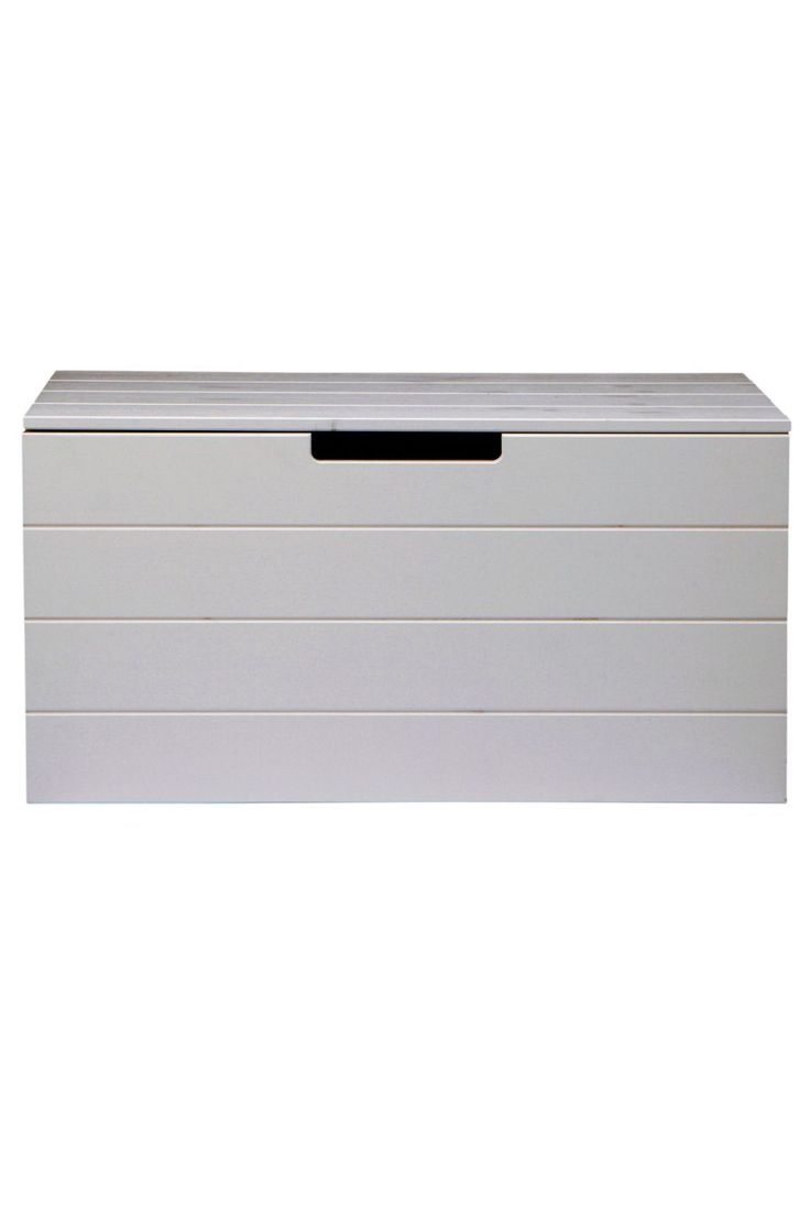 a white chest with black handles on it's sides and drawers in the front