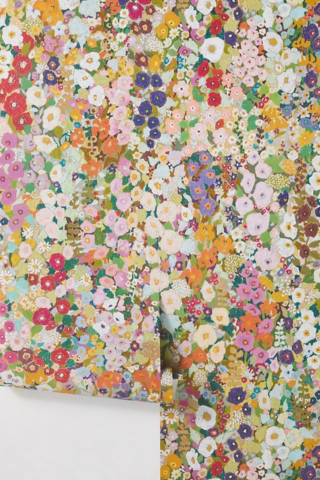 a wall covered in lots of colorful flowers