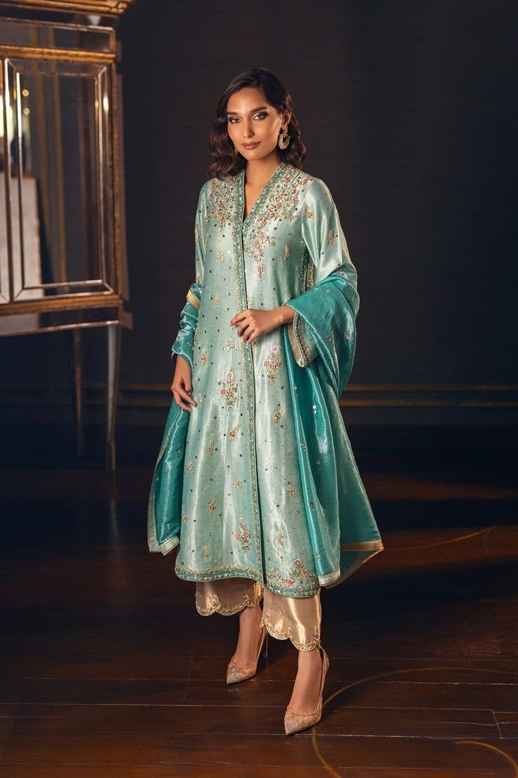 This statement sea green shir has stunning hand worked embroidery and colorful hand resham work in hues of gold. The piece is paired with tissue culottes with scalloped hand work embroidery and a fully Hand worked dupatta. ✨This outfit is perfect of any festive party, wedding function  ✨If you want any changes in the outfit please contact us. This dress can be customise in any other colour and in all size.We will make this dress as per your choice. ✨There may be slight colour difference due to high quality camera resolution and other filters.  🌸Care Instruction Dry clean only Zuri Aesthetic, Eastern Wear, Suit Indian, Pearl Work, Resham Work, Embroidered Anarkali, Pakistani Suit, Suit Ideas, Dresses Design