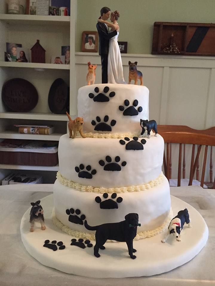 a wedding cake with dogs and cats on it