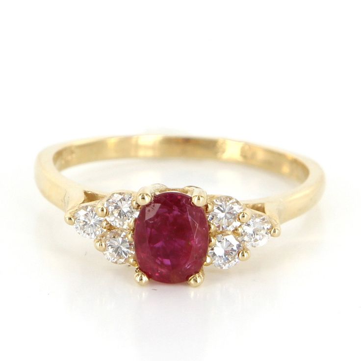 "Vintage Cocktail Ring Overview: Offered for sale is a truly superb vintage small cocktail or right hand ring, crafted in 14 karat yellow gold. The mount features one oval shape mixed cut natural ruby totaling an estimated .70 carat. Dark red in color, noticeably included, good cut, African origin, heated. Six approx. full cut round diamonds totaling an estimated .30 carat. Appraisal certificate included. Estimated Selling Price New: $1,375.00. A beautifully made ring in excellent original condi Classic Yellow Gold Ruby Ring Gia Certified, Classic Yellow Gold Gia Certified Ruby Ring, Classic Ruby Cluster Ring With Gemstone, Classic Red Oval Cluster Ring, Classic Red Cluster Ring, Oval Brilliant Cut Ruby Ring In 14k Gold, 14k Gold Ruby Ring With Brilliant Cut Oval Shape, Fine Jewelry Gold Ruby Ring Gia Certified, Heirloom Oval Ruby Ring Gia Certified