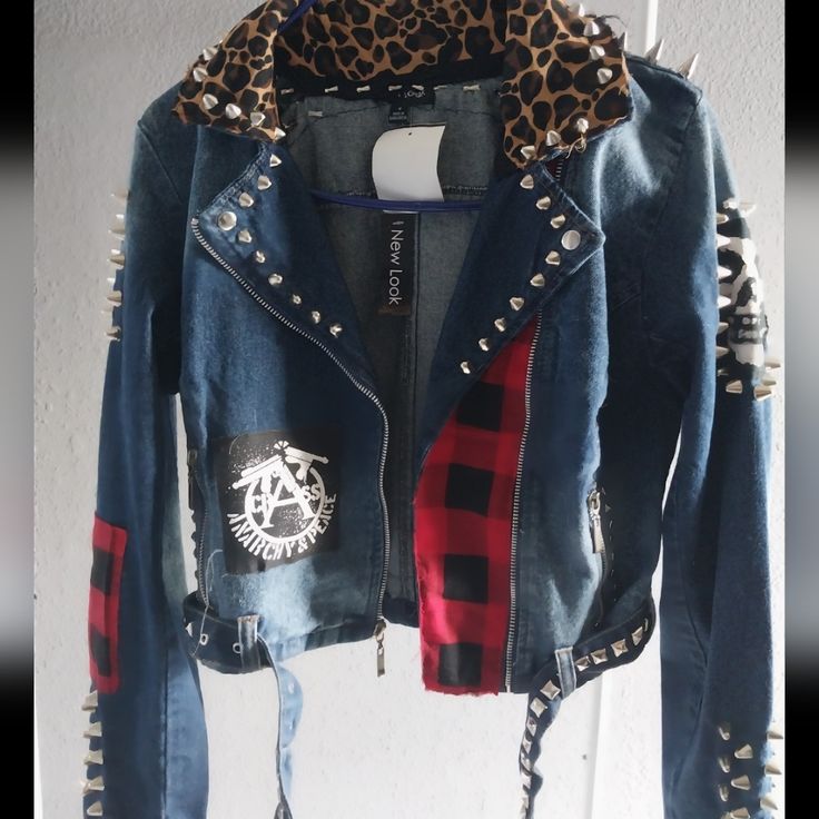 Women Punk Jacket Custom Women's Motor Denim Punk Rock Jacket Condition: Never Worn Material: Denim Size:M (Junior) All Band Patches And Patterns Are Sewn Manually. They Are, In My Opinion, Binded Securely. Every Stud And Spikes Are Applied Manually, Too. I Also Sewn Fabric Padding To Prevent Injury From The Studs I Applied. The Jacket Has Two Zipper Pockets. Feel Like Badass When You Wear This Rocker Biker Jacket For Fall Alternative Fashion, Fall Streetwear Biker Jacket With Rivets, Spring Punk Biker Jacket With Rivets, Fall Denim Jacket With Rivets And Long Sleeves, Punk Biker Jacket For Fall, Punk Biker Jacket For Alternative Fashion In Fall, Fall Punk Biker Jacket For Alternative Fashion, Edgy Denim Outerwear For Alternative Fashion, Fall Long Sleeve Denim Jacket With Rivets