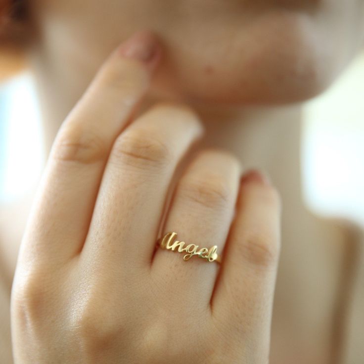 "14K Solid Gold Name Ring-Dainty Name Ring- Custom Stacking Name Ring - Birthday Gift- Bridesmaid-Gift For Mom-Gift For Her 14K Solid Gold Name ring will be handmade with your desired, Here is a dainty, delicate and simple, yet classy minimalist Name Ring . This is 14k Solid Yellow Gold. (this necklace is 100% real. It's not plated ) Perfect for everyday use. A beautiful customized gift for yourself or someone you care for. \"What's in a name?\" Spell out a name and let us create a beautiful gif Adjustable Initial Ring With Birthstone For Wedding, Personalized Yellow Gold Wedding Jewelry, Elegant Stackable Wedding Rings With Initials, Open Initial Ring With Birthstone For Wedding, Initial Ring For Wedding, Yellow Gold Stackable Initial Ring For Wedding, Yellow Gold Stackable Initial Wedding Ring, Personalized Yellow Gold Initial Ring For Wedding, Yellow Gold Initial Ring For Mother's Day Wedding