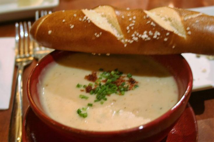 a sandwich on top of a bowl of soup